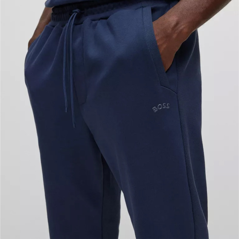 Les pantalons de survêtement Boss HADIKO CURVED Bleu Chez DM'Sports